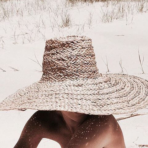 SPF hat on sand